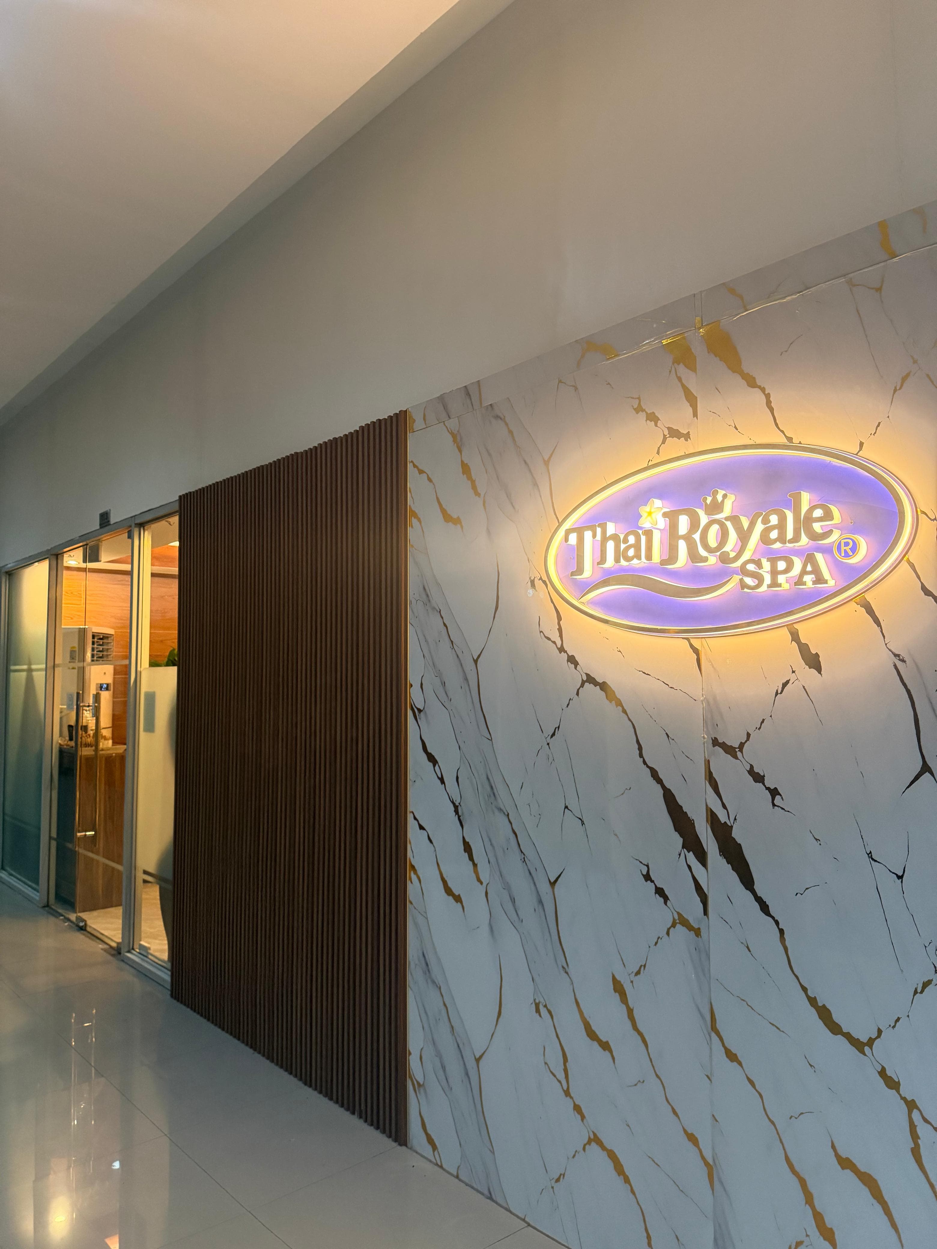 The Thai Royale Spa entrance on North EDSA — illuminated brand mark on marble